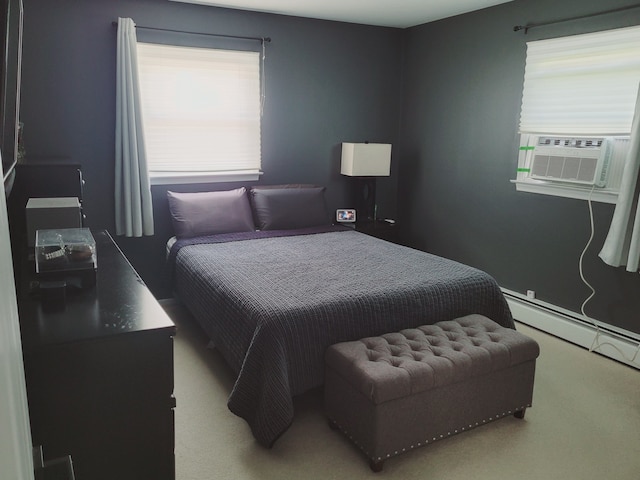 bedroom featuring carpet flooring and a baseboard heating unit