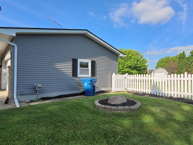 view of property exterior with a fire pit