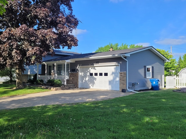 view of front of property with an attached garage, concrete driveway, and covered porch