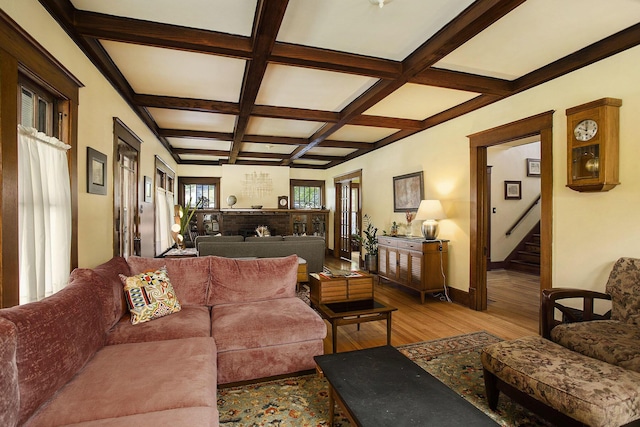 living area featuring wood-type flooring, coffered ceiling, stairs, beam ceiling, and baseboards