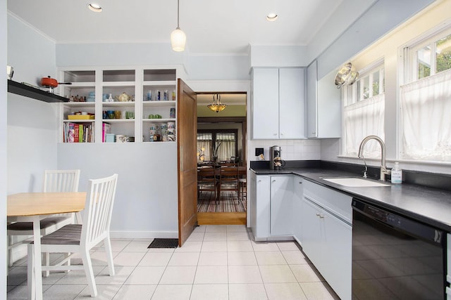 kitchen featuring black dishwasher, a sink, dark countertops, crown molding, and white cabinets