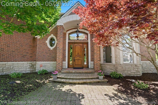 4563 Haverhill, Commerce Twp, MI 48382 - view of exterior entry featuring brick siding