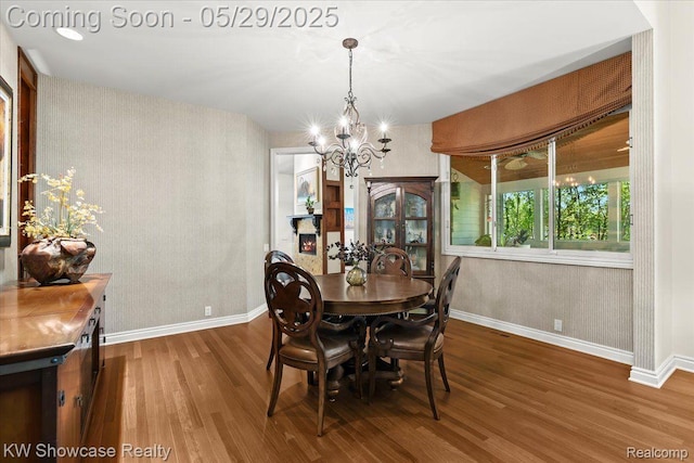 4563 Haverhill, Commerce Twp, MI 48382 - dining room with wood finished floors, baseboards, and a chandelier