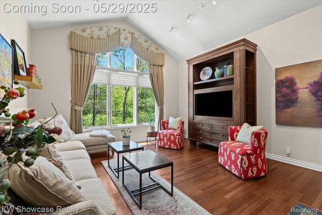 4563 Haverhill, Commerce Twp, MI 48382 - living room featuring vaulted ceiling, track lighting, wood finished floors, and baseboards