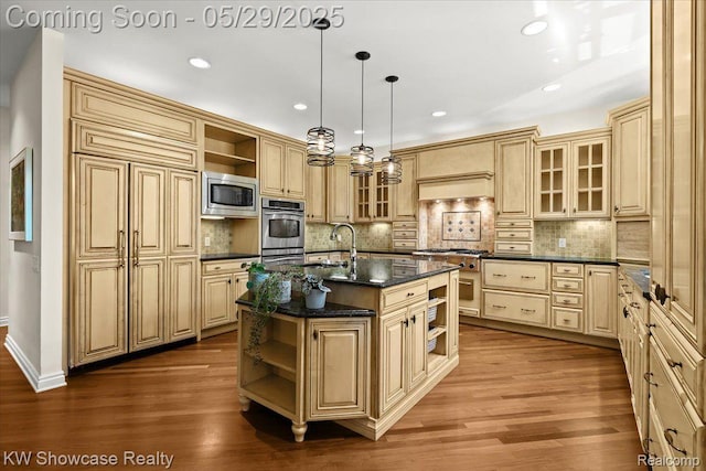 4563 Haverhill, Commerce Twp, MI 48382 - kitchen with open shelves, stainless steel appliances, a kitchen island with sink, wood finished floors, and recessed lighting