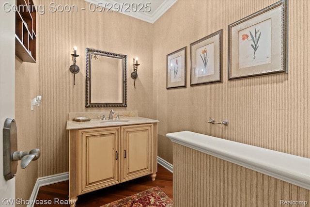 4563 Haverhill, Commerce Twp, MI 48382 - bathroom featuring wood finished floors, vanity, ornamental molding, and baseboards