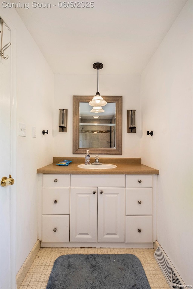 4371 E Cook Rd, Grand Blanc, MI 48439 - bathroom featuring baseboards, vanity, and tile patterned floors