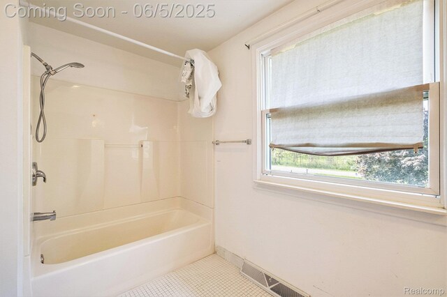 4371 E Cook Rd, Grand Blanc, MI 48439 - full bath with tile patterned flooring, shower / tub combination, and baseboards