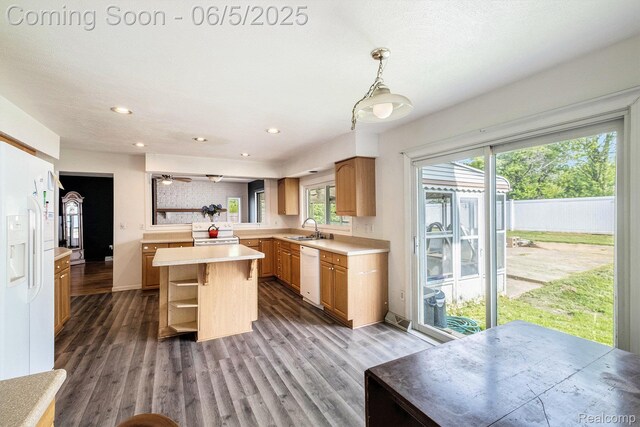 4371 E Cook Rd, Grand Blanc, MI 48439 - kitchen featuring white appliances, open shelves, a sink, a kitchen island, and light countertops