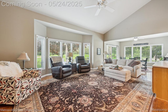 921 Gleneagles, Highland, MI 48357 - living area with ceiling fan, wood finished floors, high vaulted ceiling, and baseboards