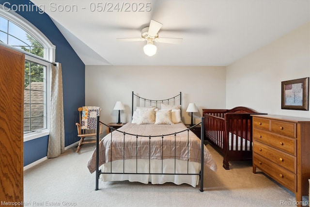 921 Gleneagles, Highland, MI 48357 - bedroom with light carpet, vaulted ceiling, ceiling fan, and baseboards