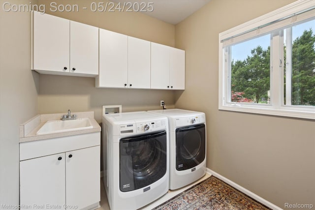 921 Gleneagles, Highland, MI 48357 - laundry room featuring cabinet space, separate washer and dryer, and baseboards
