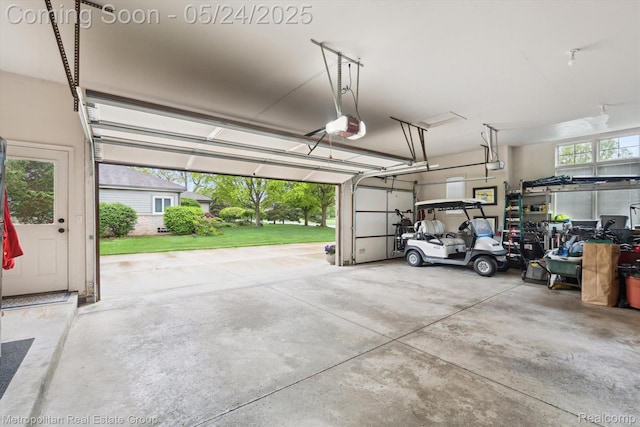 921 Gleneagles, Highland, MI 48357 - garage with a garage door opener
