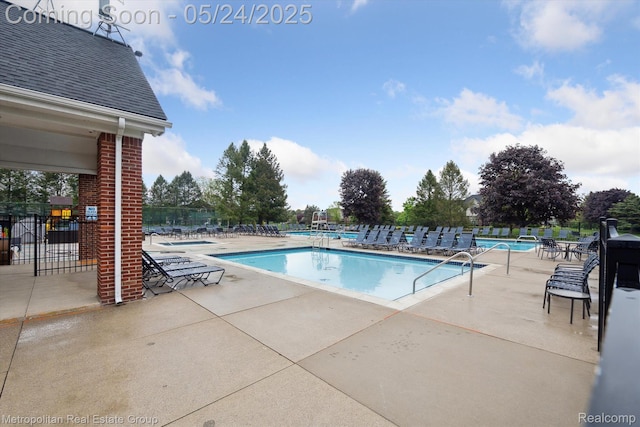 921 Gleneagles, Highland, MI 48357 - community pool featuring a patio