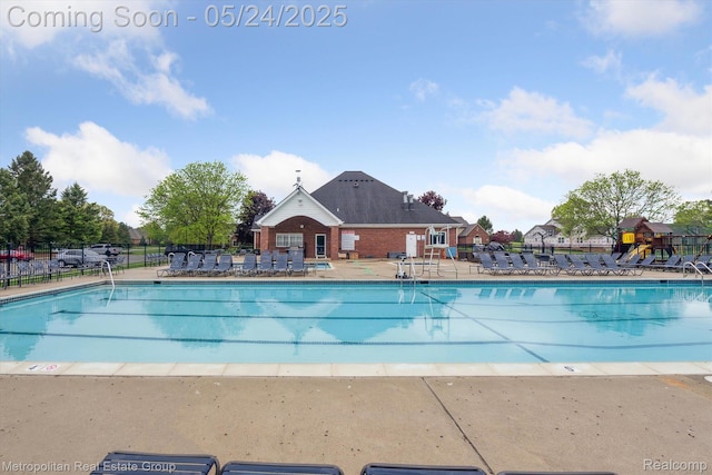 921 Gleneagles, Highland, MI 48357 - community pool with a patio