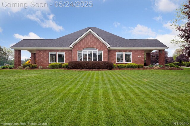 921 Gleneagles, Highland, MI 48357 - ranch-style home featuring brick siding and a front lawn