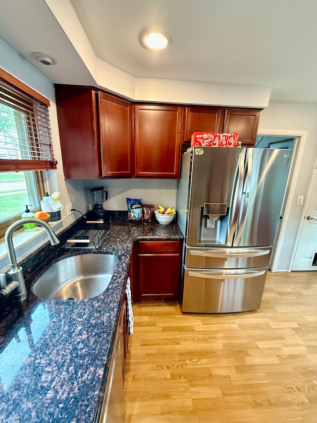 992 Key W Dr, Clawson, MI 48017 - kitchen with stainless steel fridge, a sink, light wood-style flooring, and reddish brown cabinets