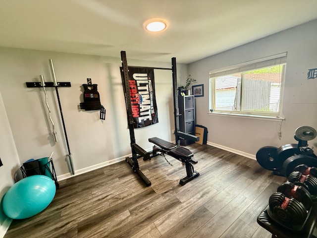992 Key W Dr, Clawson, MI 48017 - workout room with dark wood-type flooring and baseboards