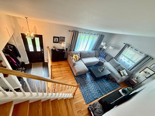 992 Key W Dr, Clawson, MI 48017 - living area featuring wood finished floors and a chandelier