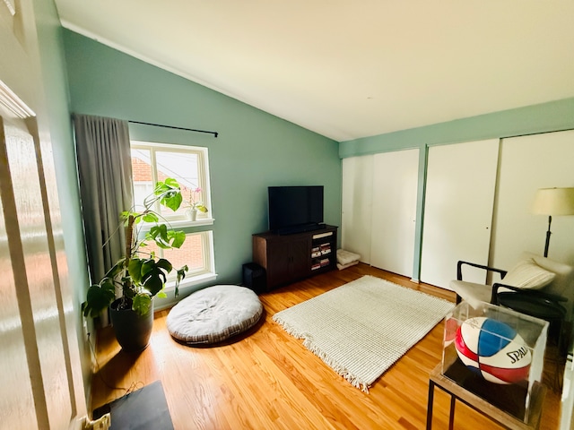 992 Key W Dr, Clawson, MI 48017 - living room with lofted ceiling and wood finished floors