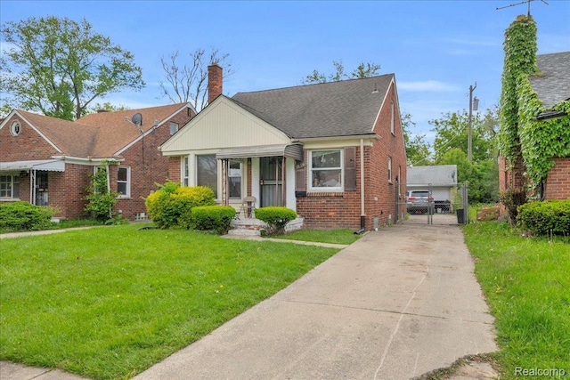 18305 Glastonbury Rd, Detroit, MI 48219 - bungalow-style home with brick siding, a gate, a front yard, and a chimney