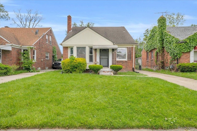 18305 Glastonbury Rd, Detroit, MI 48219 - bungalow featuring brick siding, a front lawn, a chimney, and a shingled roof