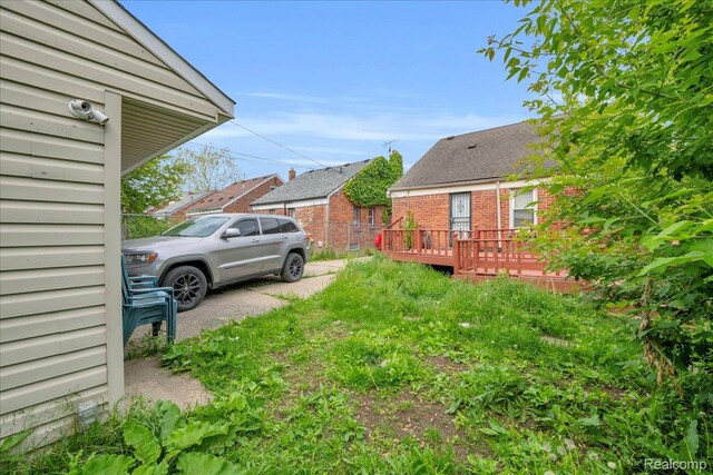 18305 Glastonbury Rd, Detroit, MI 48219 - view of yard featuring a wooden deck