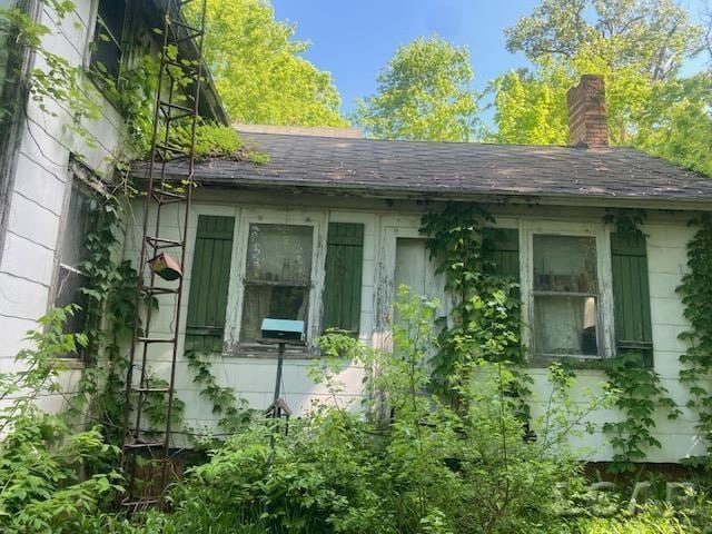 1171 S Rogers Hwy, Palmyra, MI 49268 - view of home's exterior featuring a chimney