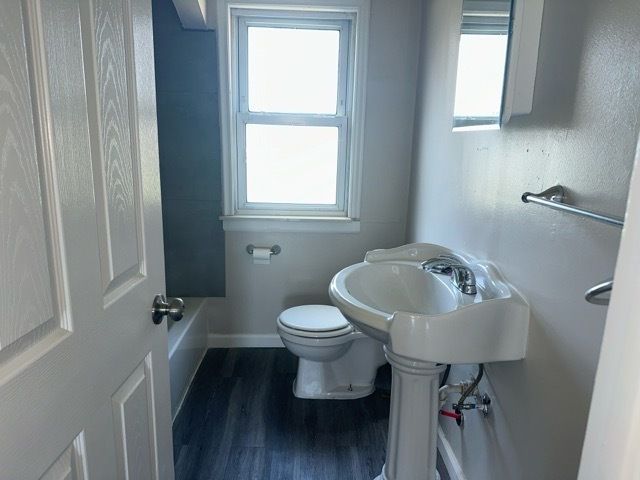 1688 S Ethel St, Detroit, MI 48217 - full bath featuring toilet, wood finished floors, and baseboards