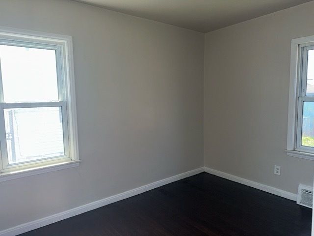 1688 S Ethel St, Detroit, MI 48217 - unfurnished room featuring dark wood finished floors and baseboards