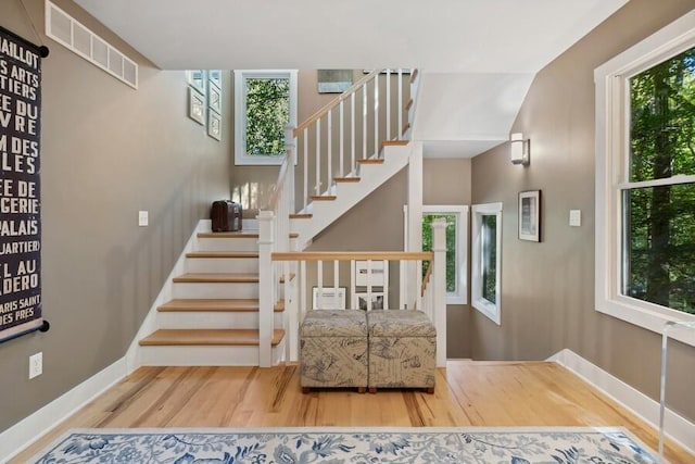 9366 E Locke Rd, Union Pier, MI 49129 - stairs with wood finished floors, healthy amount of natural light, and baseboards