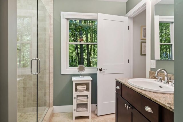 9366 E Locke Rd, Union Pier, MI 49129 - full bathroom featuring a shower stall, vanity, tile patterned floors, and baseboards