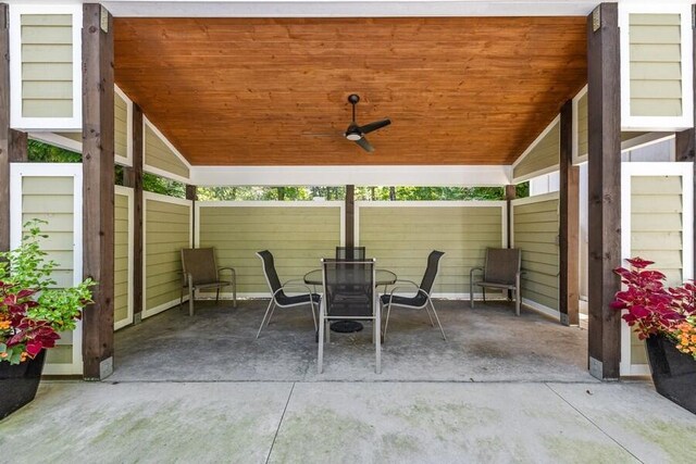 9366 E Locke Rd, Union Pier, MI 49129 - view of patio with fence, outdoor dining area, and a ceiling fan