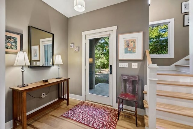 9366 E Locke Rd, Union Pier, MI 49129 - entrance foyer with healthy amount of natural light, wood finished floors, stairs, and baseboards