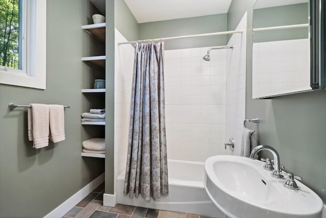 9366 E Locke Rd, Union Pier, MI 49129 - full bath featuring a sink, shower / bathtub combination with curtain, and baseboards