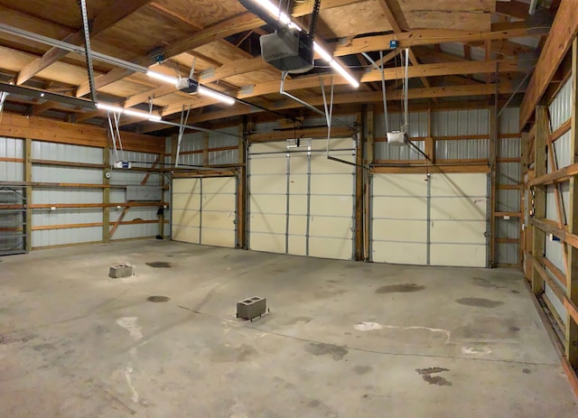1483 W Bear Lake Rd NE, Kalkaska, MI 49646 - garage featuring a garage door opener