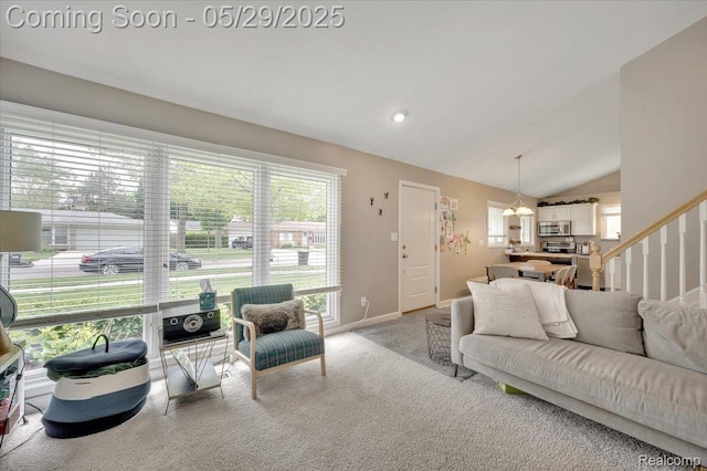 1227 Sycamore Dr, Rochester Hills, MI 48307 - living room with vaulted ceiling, light carpet, stairway, and baseboards