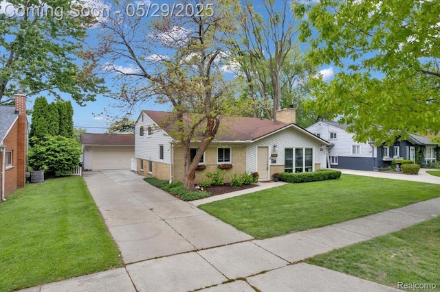 1227 Sycamore Dr, Rochester Hills, MI 48307 - view of front of house featuring brick siding, an outbuilding, a front yard, a detached garage, and cooling unit