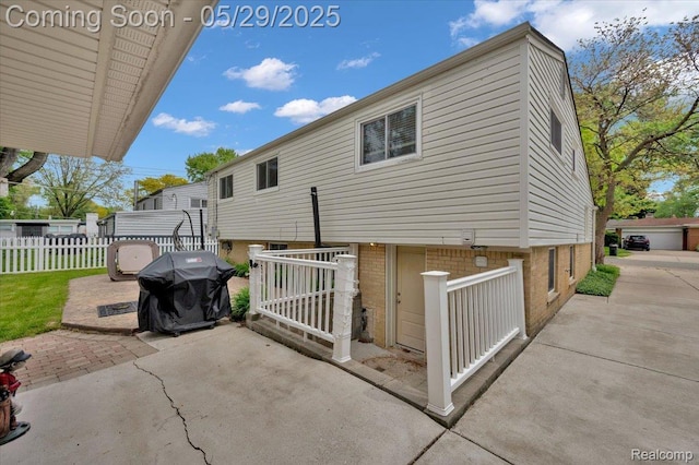 1227 Sycamore Dr, Rochester Hills, MI 48307 - rear view of house with a patio and brick siding