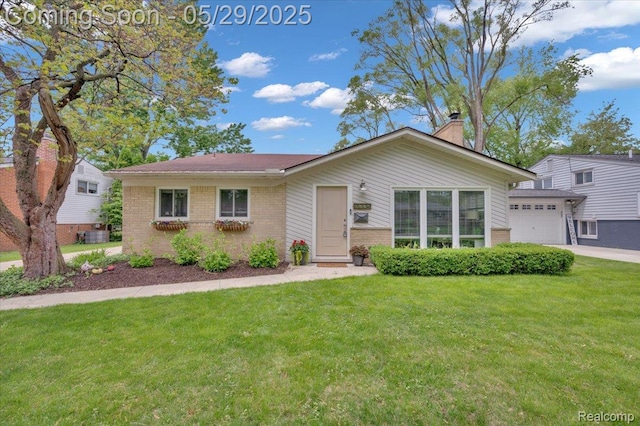 1227 Sycamore Dr, Rochester Hills, MI 48307 - view of front of house with brick siding, a front lawn, a chimney, and an attached garage