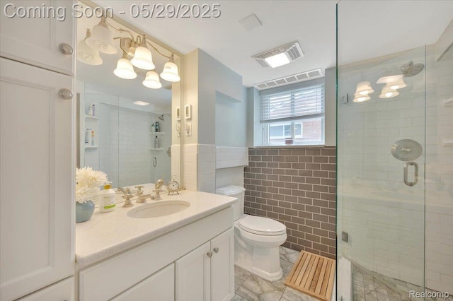 1227 Sycamore Dr, Rochester Hills, MI 48307 - full bath with tile walls, a shower stall, toilet, vanity, and wainscoting