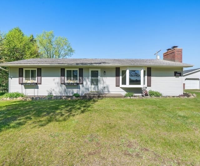 11589 Owosso Rd, Fowlerville, MI 48836 - view of front of house with a chimney and a front yard