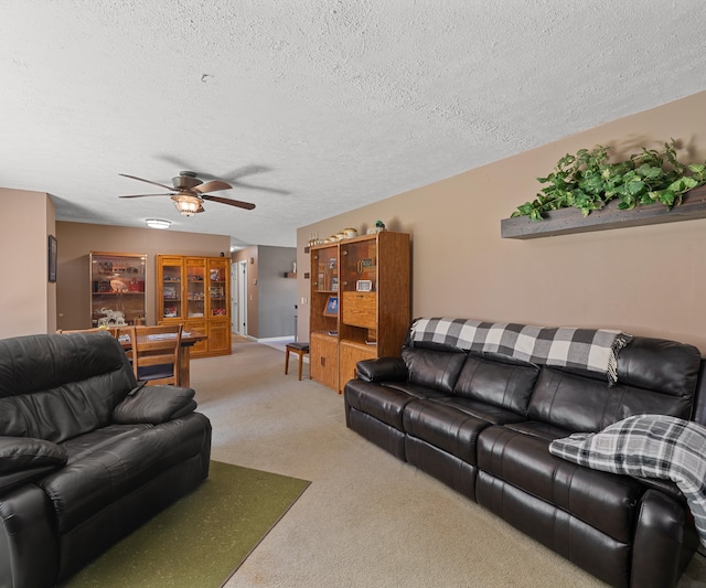 11589 Owosso Rd, Fowlerville, MI 48836 - living area with a ceiling fan, carpet flooring, and a textured ceiling
