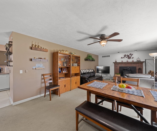 11589 Owosso Rd, Fowlerville, MI 48836 - living room featuring ceiling fan, a textured ceiling, light carpet, and a fireplace