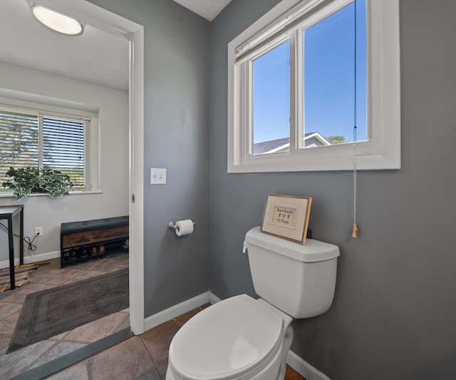11589 Owosso Rd, Fowlerville, MI 48836 - bathroom with baseboards and toilet