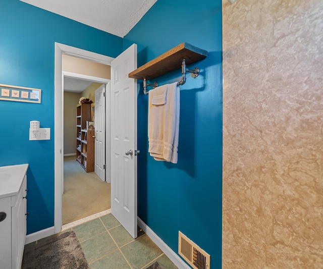 11589 Owosso Rd, Fowlerville, MI 48836 - bathroom featuring baseboards and vanity