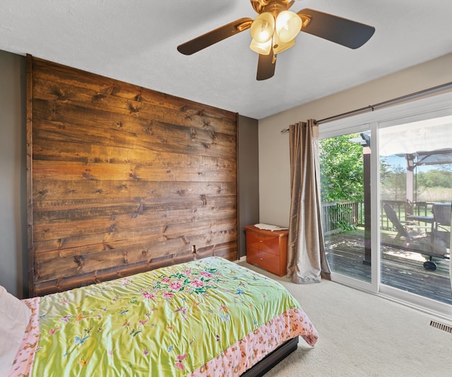 11589 Owosso Rd, Fowlerville, MI 48836 - carpeted bedroom with access to exterior and ceiling fan
