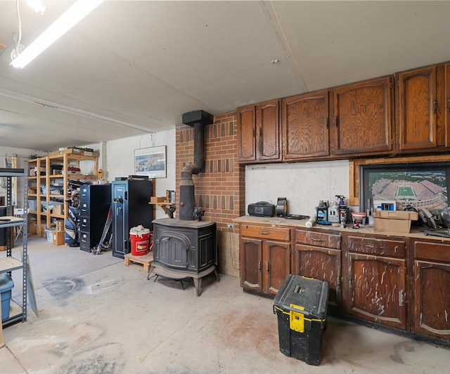 11589 Owosso Rd, Fowlerville, MI 48836 - garage with a wood stove
