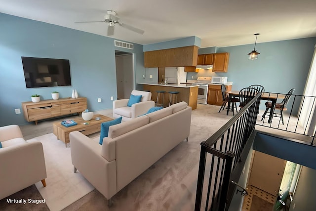 1478 Harbor Dr, Walled Lake, MI 48390 - living area featuring a ceiling fan and light carpet