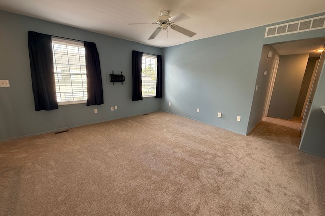 1478 Harbor Dr, Walled Lake, MI 48390 - spare room featuring a ceiling fan, carpet, and baseboards